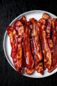 strips of cooked bacon on a plate